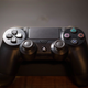 Pictured is a close up of the PS4 and its controller.